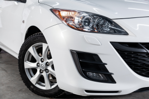 Front end of a white Mazda