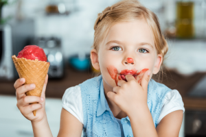 Little girl eating ice cream cone